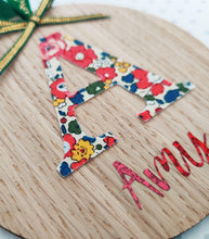 Load image into Gallery viewer, Personalised Christmas Oak Veneer Ornament - Liberty Print Inital and Red Holographic Vinyl - Green Ribbon Trims - BoutiqueCrafts