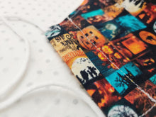 Load image into Gallery viewer, Halloween Face Mask - Removable Nose Wire - Filter Pocket - Adjustable Elastic Ties - Pumpkin Print - Turquoise Polka Dot Lining - BoutiqueCrafts
