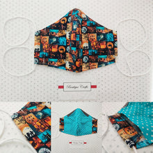 Load image into Gallery viewer, Halloween Face Mask - Removable Nose Wire - Filter Pocket - Adjustable Elastic Ties - Pumpkin Print - Turquoise Polka Dot Lining - BoutiqueCrafts
