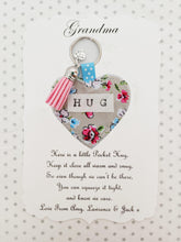 Load image into Gallery viewer, Handmade Pocket Hug heart fabric keyring with tassel - Painterly Floral Print - bag charm - missing you gift - stay safe gift - BoutiqueCrafts
